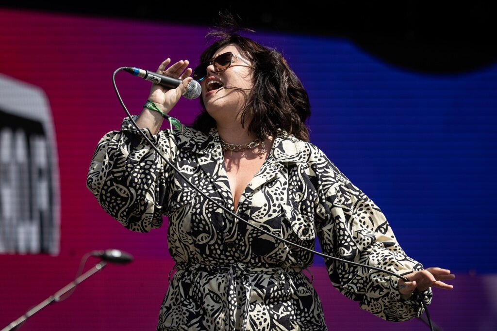 A singer performing on an Austin City Limits Music Festival stage, one of the biggest Austin festivals and events