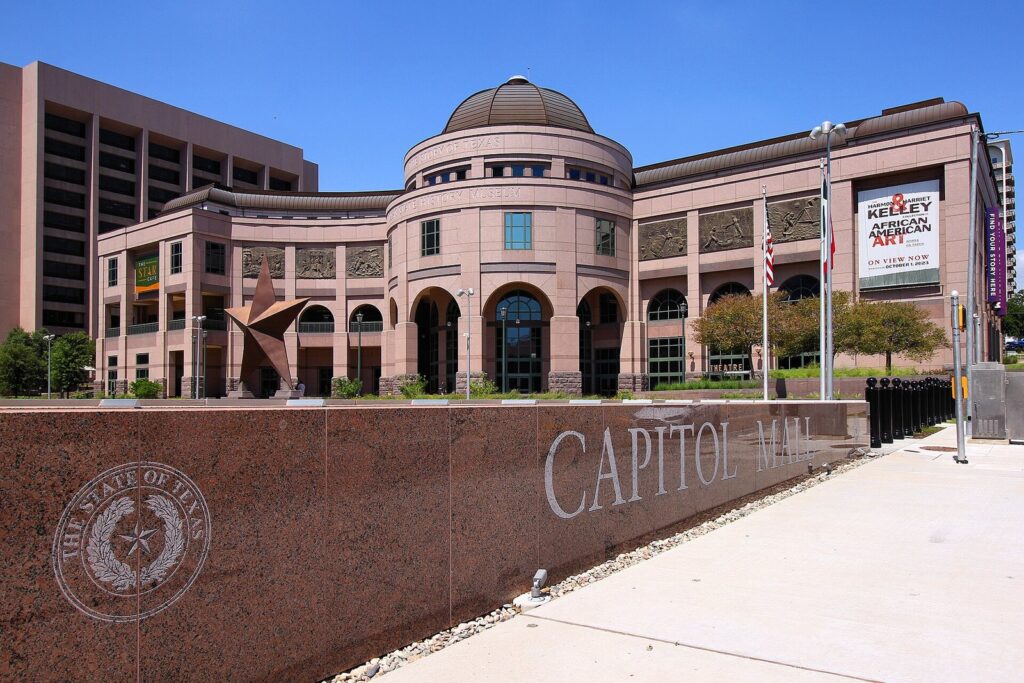 Bullock Texas State History Museum on the Capitol Mall, with its domed entrance and large star sculpture
