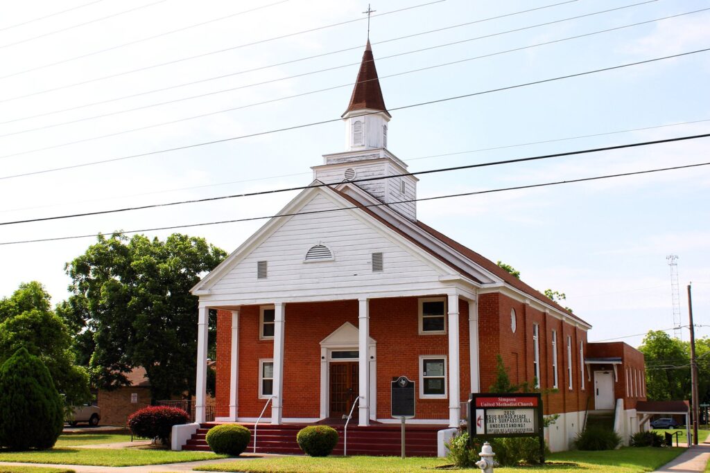 Simpson Memorial Methodist Church in East Austin, a red-brick church with white columns and a white steeple