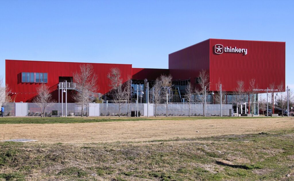 The red Thinkery children's museum building at Mueller, one of the top things to do in Austin with kids